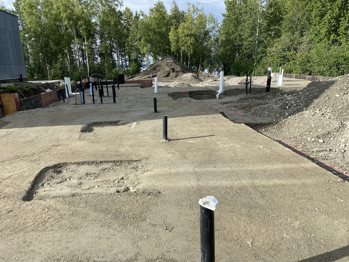 Graded commercial building pad with utility stubs, BTH Construction Anchorage Alaska